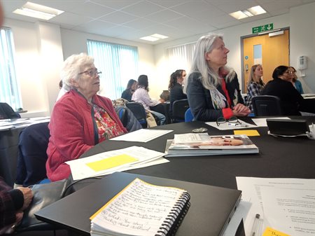 Attendees listening intently.