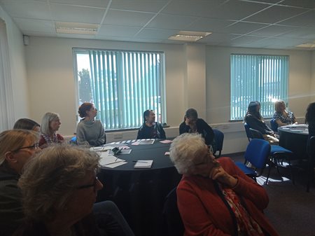 Attendees listening intently.