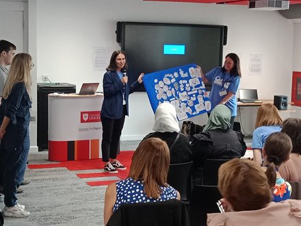 Kate Lugar discusses her collage of artwork created throughout the conference day