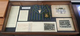 Part of the Geographical Society centenary exhibition, showing the display of sporting items, including a 1940s University College Nottingham blazer donated by former student Gwynneth Enoch