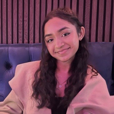 Photo of Akshaya Kerupagaran, Biochemistry and Molecular Medicine Undergraduate wearing a brown coat