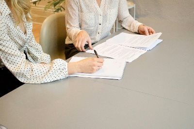 Two women with paperwork