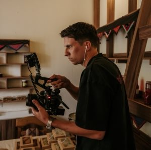 Leo Lightfoot holding a camera