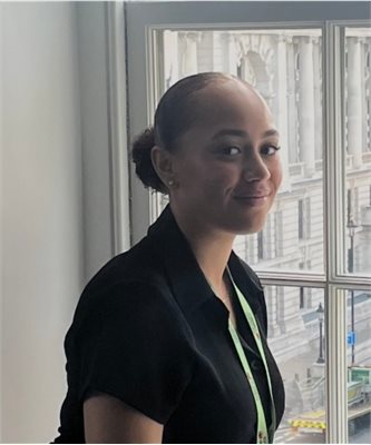 Phot of Maia Linley-Adams wearing black and smiling at the camera