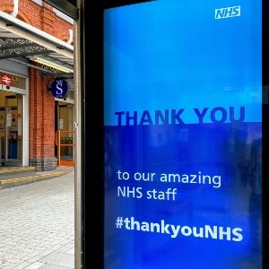 An advert on a bus shelter saying Thank you to our amazing NHS staff