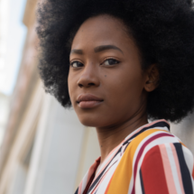 Headshot of Theresa Lola.