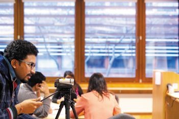 Person recording on a video camera