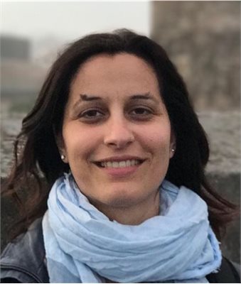 Dr Martina Salvante smiles, wearing a light blue scarf