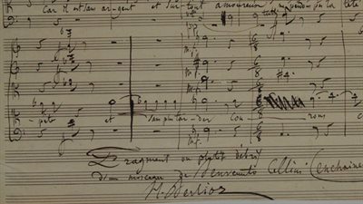 Berlioz. A sheet of music, black ink on yellow paper.