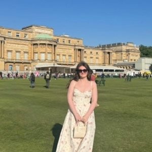 Elise Mcloughlin standing in front of a stately home