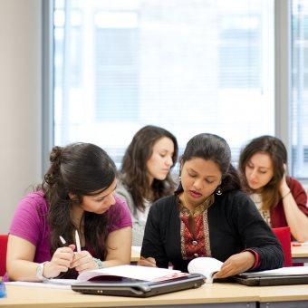 Four postgraduate students studying