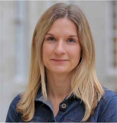 Photo of Victoria Howard wearing a blue denim shirt