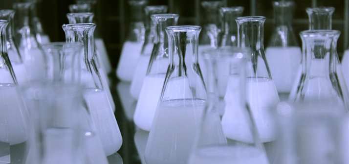 Chemistry flasks lined up in a lab