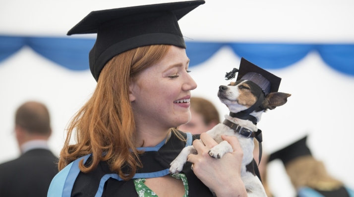 Graduate with her dog at Graduation Day