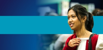 Student smiling away from the camera