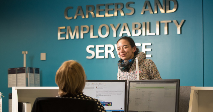 Student at the Careers reception talking to a member of the team