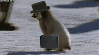 Penguin wearing a top hat and carrying a briefcase