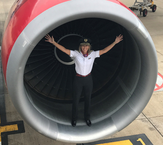 Lucy Tardrew standing in the engine of a Virgin Atlantic 747 aircraft