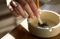 Cigarette held in ashtray