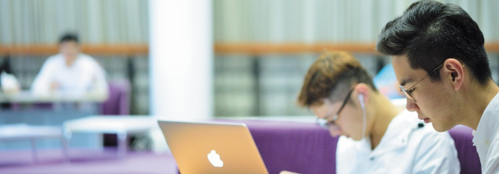 Pair of male students studying in the learning Hub, Ningbo Campus, China 714x249