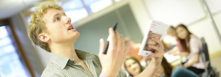 Student in classroom 714x249
