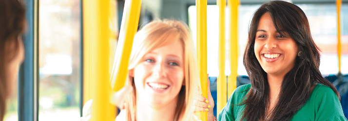 Three undergraduate students on the University Park hopper bus 714x249