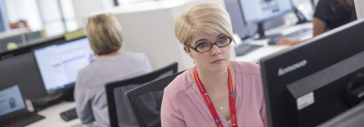 Female member of staff working in University Park Central Student Service Centre, Cherry Tree Lodge 714x249