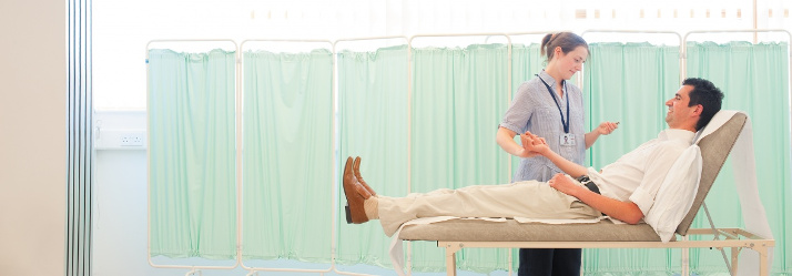 Female postgraduate student with male patient, Royal Derby Hospital 714x249