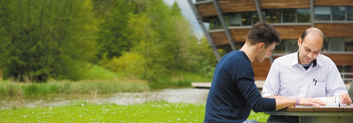 Male undergraduate and postgraduate students studying outside the Learning Resource Centre, Jubilee Campus 714x249