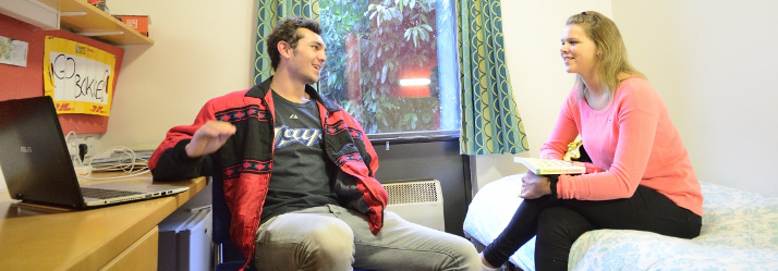 Male undergraduate student studying in Cavendish Hall, University Campus 714x249