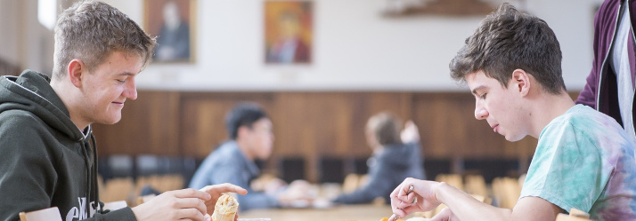 Students eating in Derby Hall Cafe situated in Derby Hall accommodation, University Park Campus 714x249