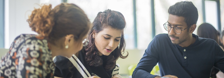 Students working in a study area 714x249