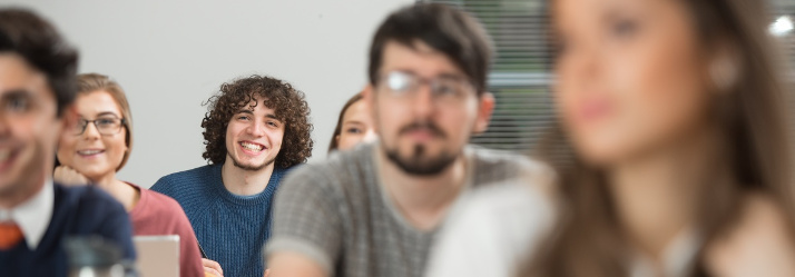 Undergraduate students in a lecture, seminar room, Highfields House, University Park 714x249