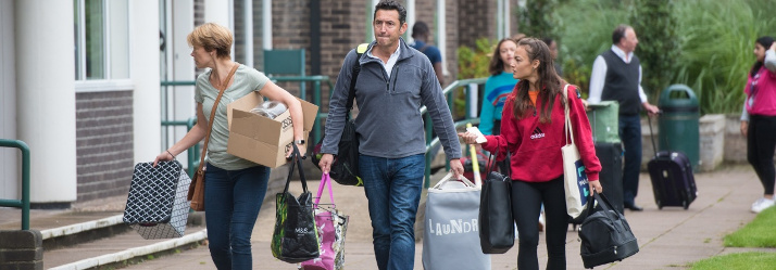 Undergraduate students moving in on Arrivals Day 2017, Rutland Hall, University Park 714x249
