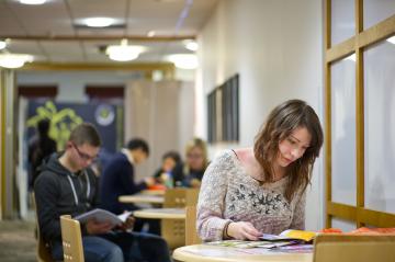 Image of student looking at pamphlets