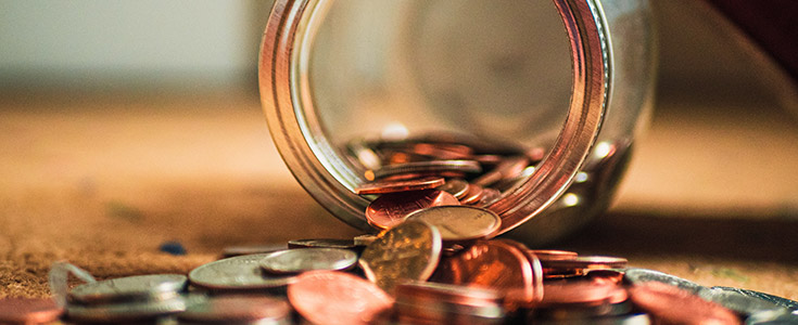 coins pouring out from a jar