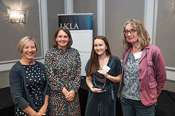 Elizabeth Jennings receiving her UKLA award with her supervisor and two UKLA representatives