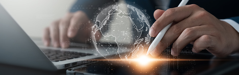 children's hands holding a model of a globe