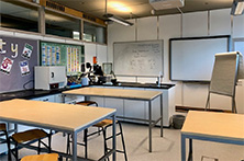 Science lab in School of Education - tables, chairs, which board, displays on wall