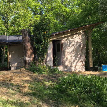 The outside of a building with a door open.