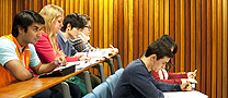 Students working in a lecture theatre.
