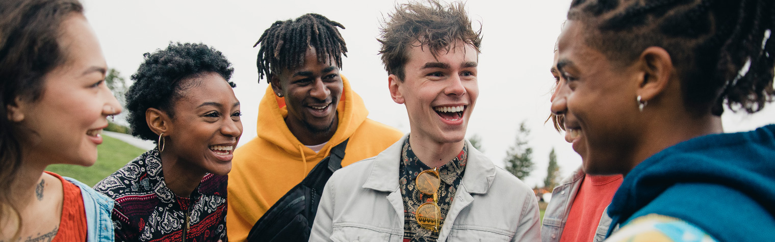 Group of students smiling and conversating