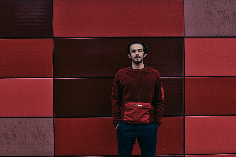 Ammar Khazal infront of red background