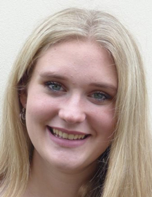 A close-up headshot of Emily Oxbury, smiling
