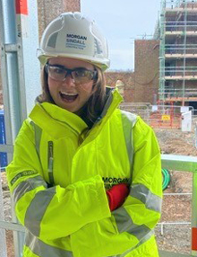 Emma Sharman smiling in a high-vis jacket