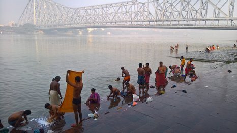 Local people interacting with the riverfront in Kolkata