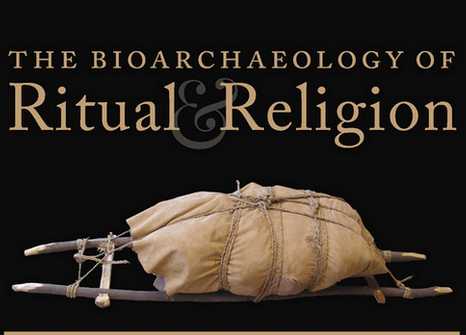 The poster for Bioarchaeology of Ritual and Religion. The gold text on a black background is above an image of a sled made from wooden poles and rope, carrying a wrapped load.