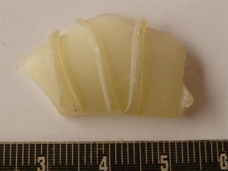 An example of a colourless trail decorated glass jar fragment from Cham island, Vietnam