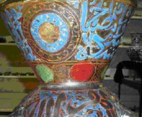 A brightly enamelled Islamic Mamluk mosque lamp probably made in Cairo.