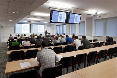 People sitting in on a seminar listening to the speaker